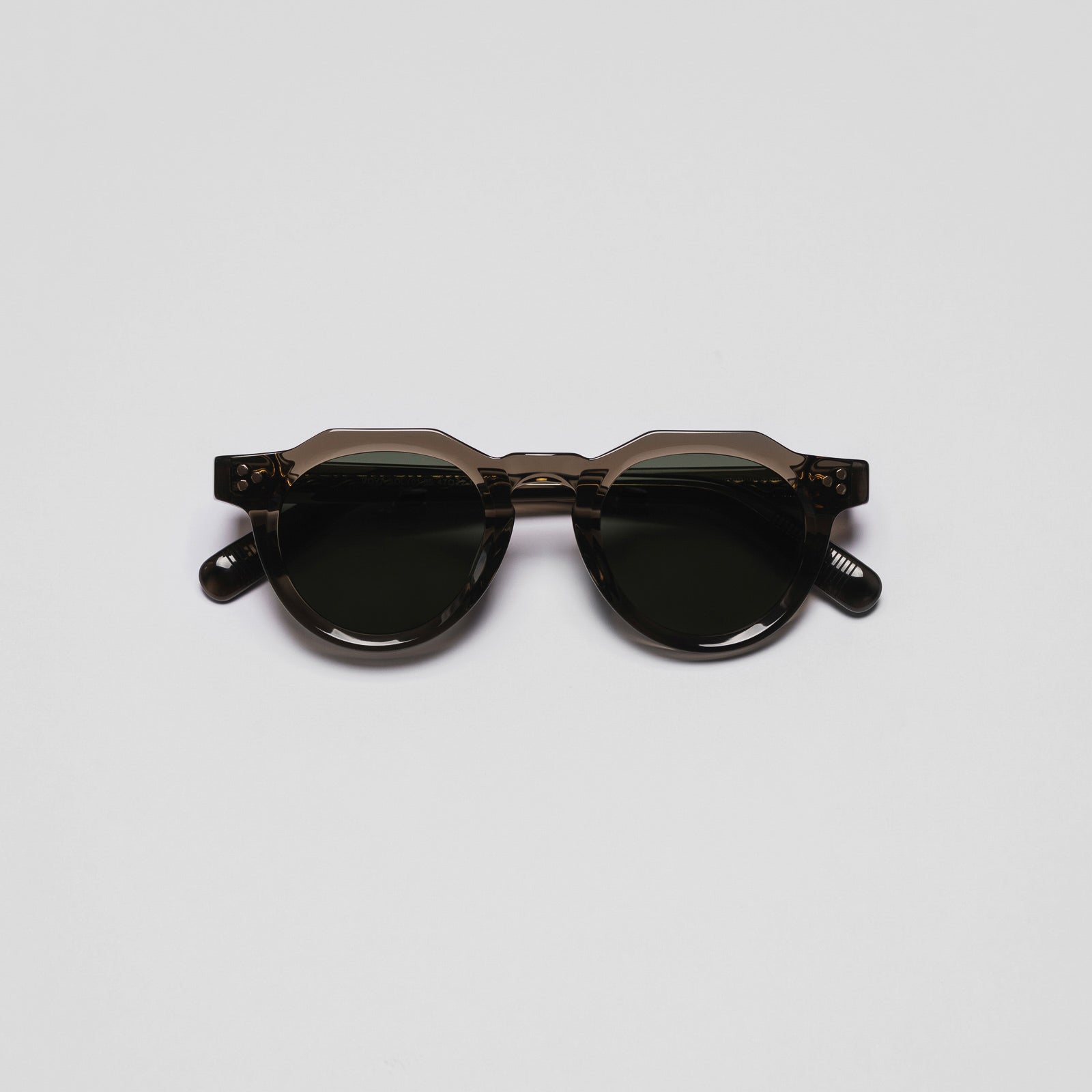 A pair of sunglasses with a space-themed design, featuring dark lenses and a frameless structure.