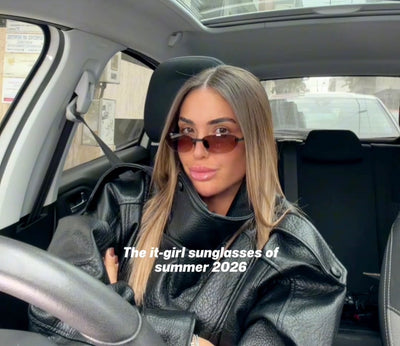 Woman sitting in a car wearing sunglasses with text overlay 'The it-girl sunglasses of summer 2026'.