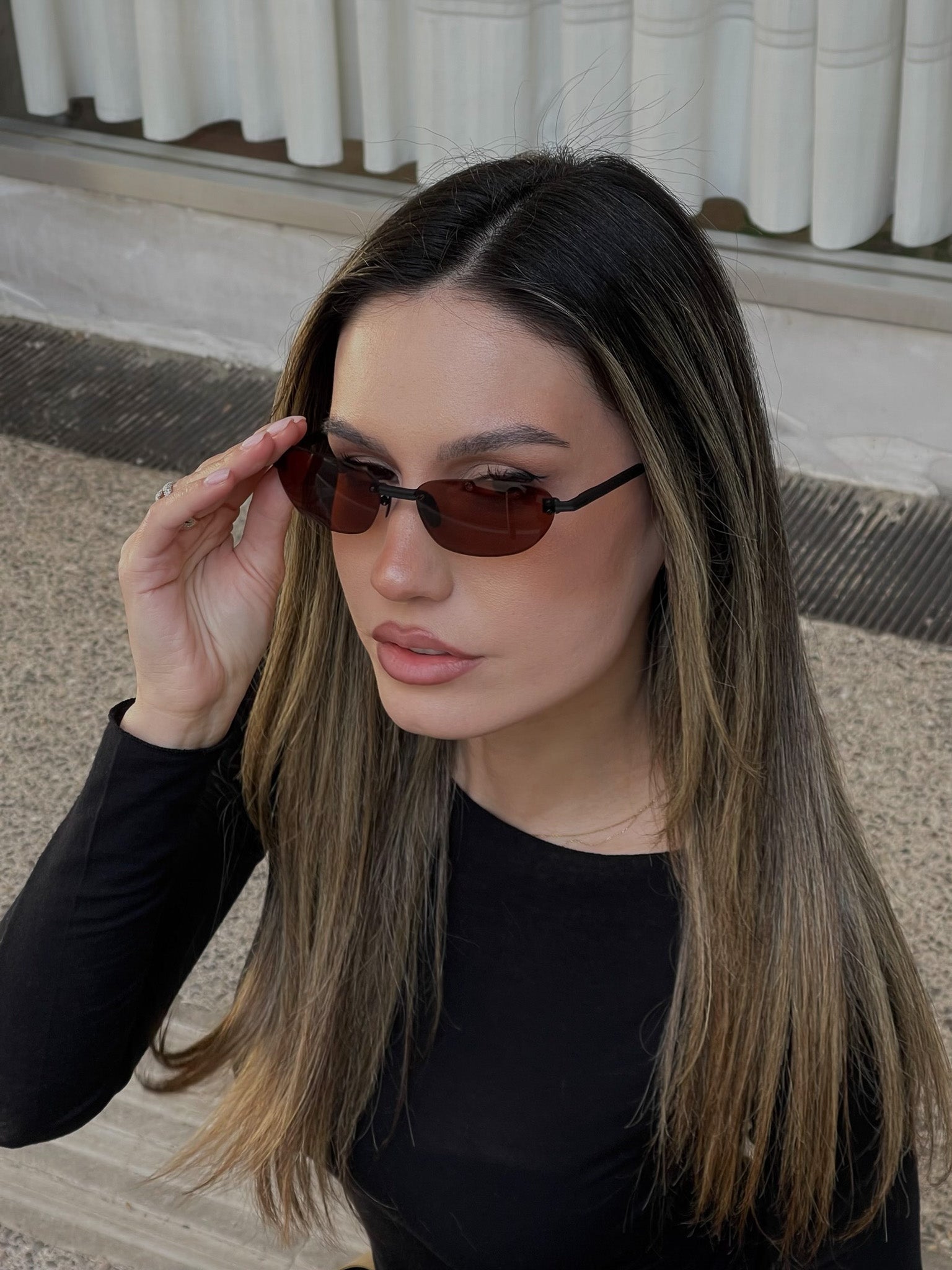 Woman wearing sunglasses with a blurred background
