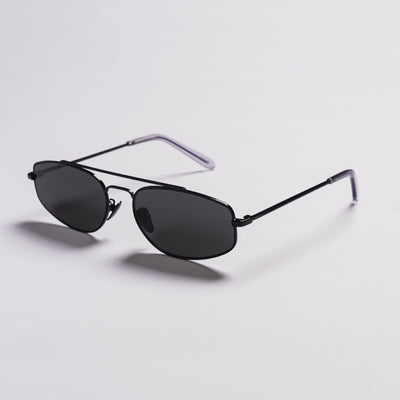 A pair of classic aviator sunglasses with dark gray lenses and a thin black metal frame, featuring translucent purple temple tips, shown on a light gray background.
