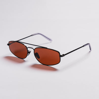 A pair of angular shield-style sunglasses with dark metal frames and translucent orange-brown lenses, shown on a clean light gray background.