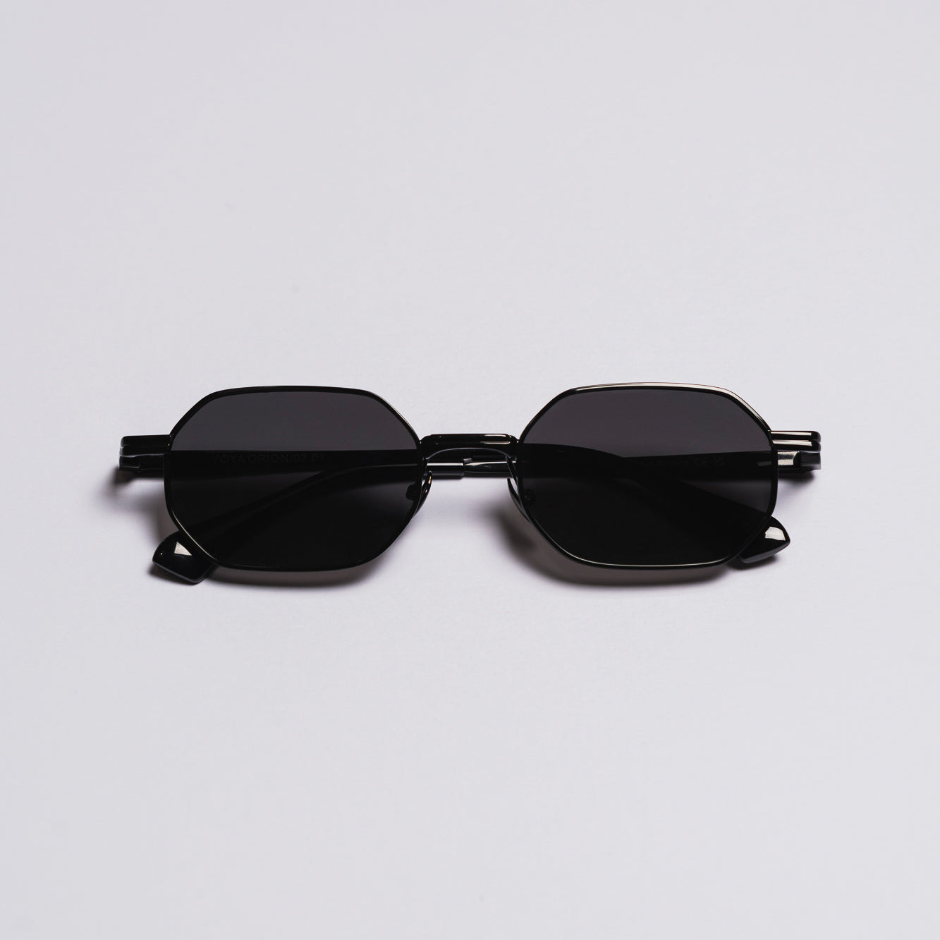 Black sunglasses on a light gray background
