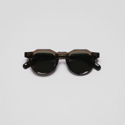 A pair of sunglasses with a space-themed design, featuring dark lenses and a frameless structure.